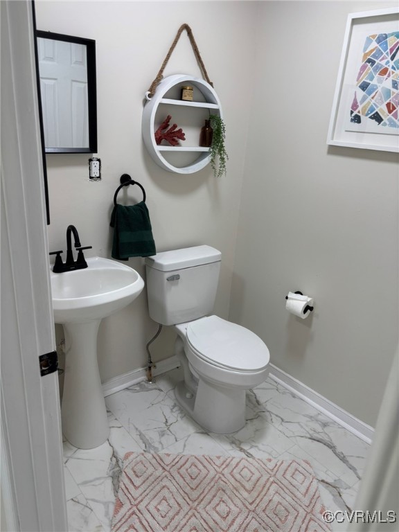 111 New South Road Kilmarnock, VA 22482 - Photo 8 of 32 Bathroom with marble look tiles and baseboards