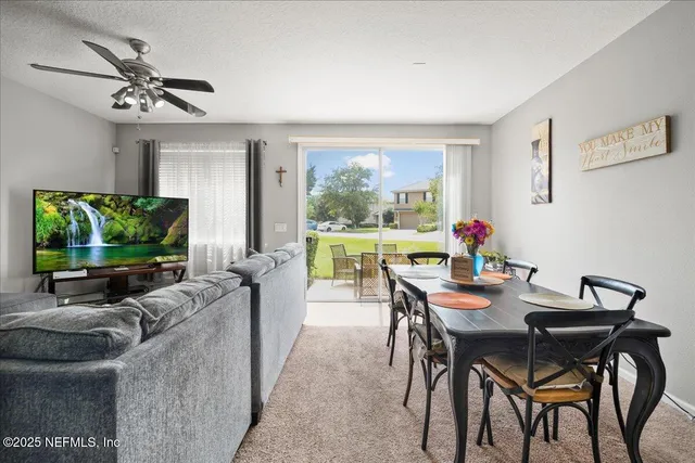 a view of a dining room with furniture window and outside view