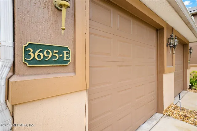 a white house with a sign on it