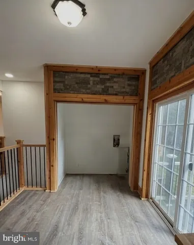 a view of room with wooden floor