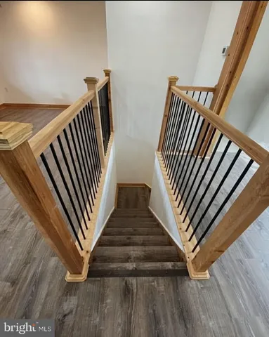 a view of staircase with white walls