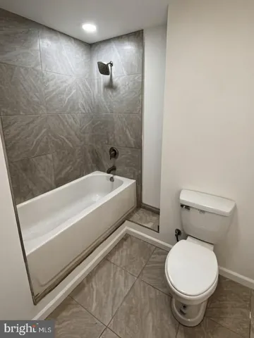 a view of room with window and closet area