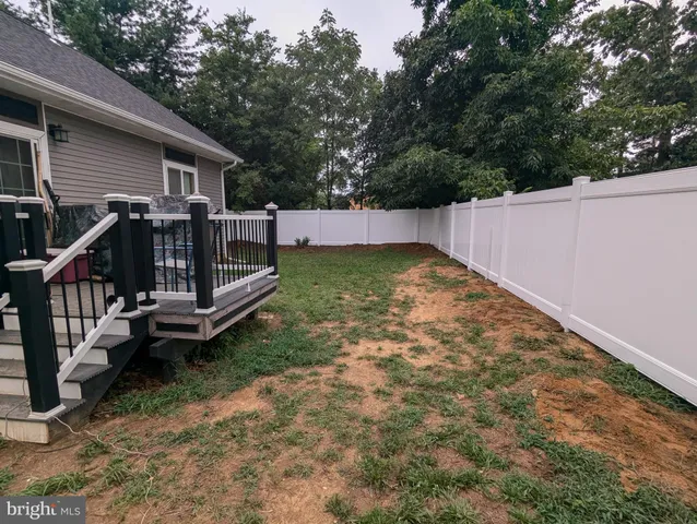 a view of deck with wooden floor and outdoor seating