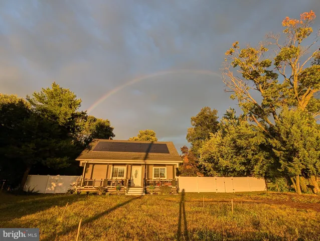 a view of a swimming pool with an outdoor seating