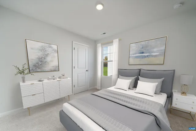 a spacious bedroom with a bed and a chandelier