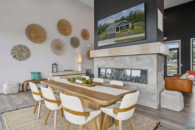 a kitchen with kitchen island granite countertop a sink a counter space appliances and cabinets