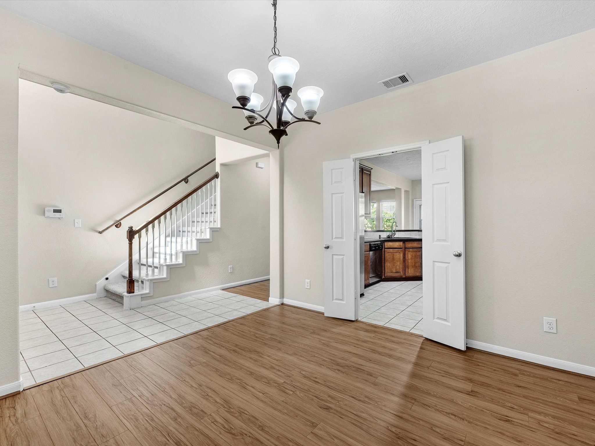 13307 Bomoseen Lake Road Houston, TX 77044 - Photo 19 of 40 a view of a hallway with wooden floor and staircase