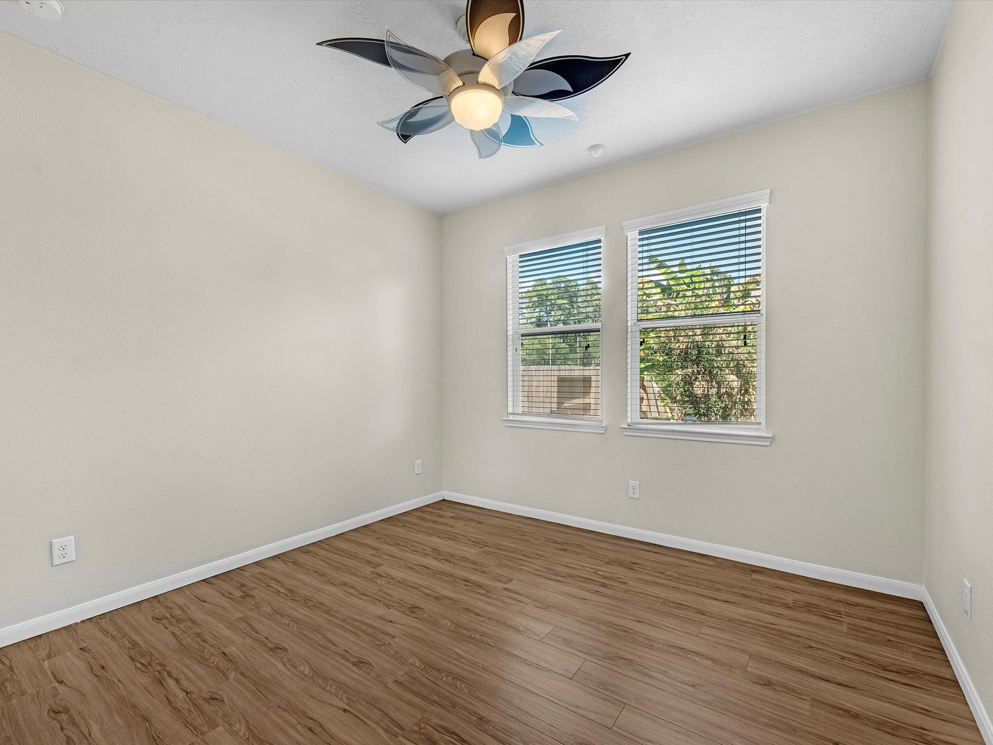 13307 Bomoseen Lake Road Houston, TX 77044 - Photo 20 of 40 wooden floor in an empty room with a window