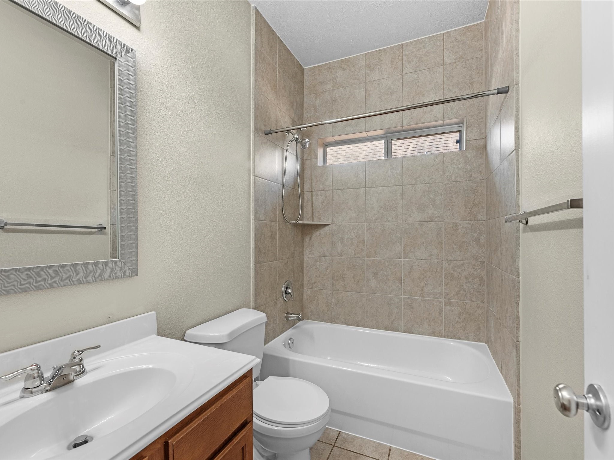 13307 Bomoseen Lake Road Houston, TX 77044 - Photo 21 of 40 a bathroom with a sink toilet and shower