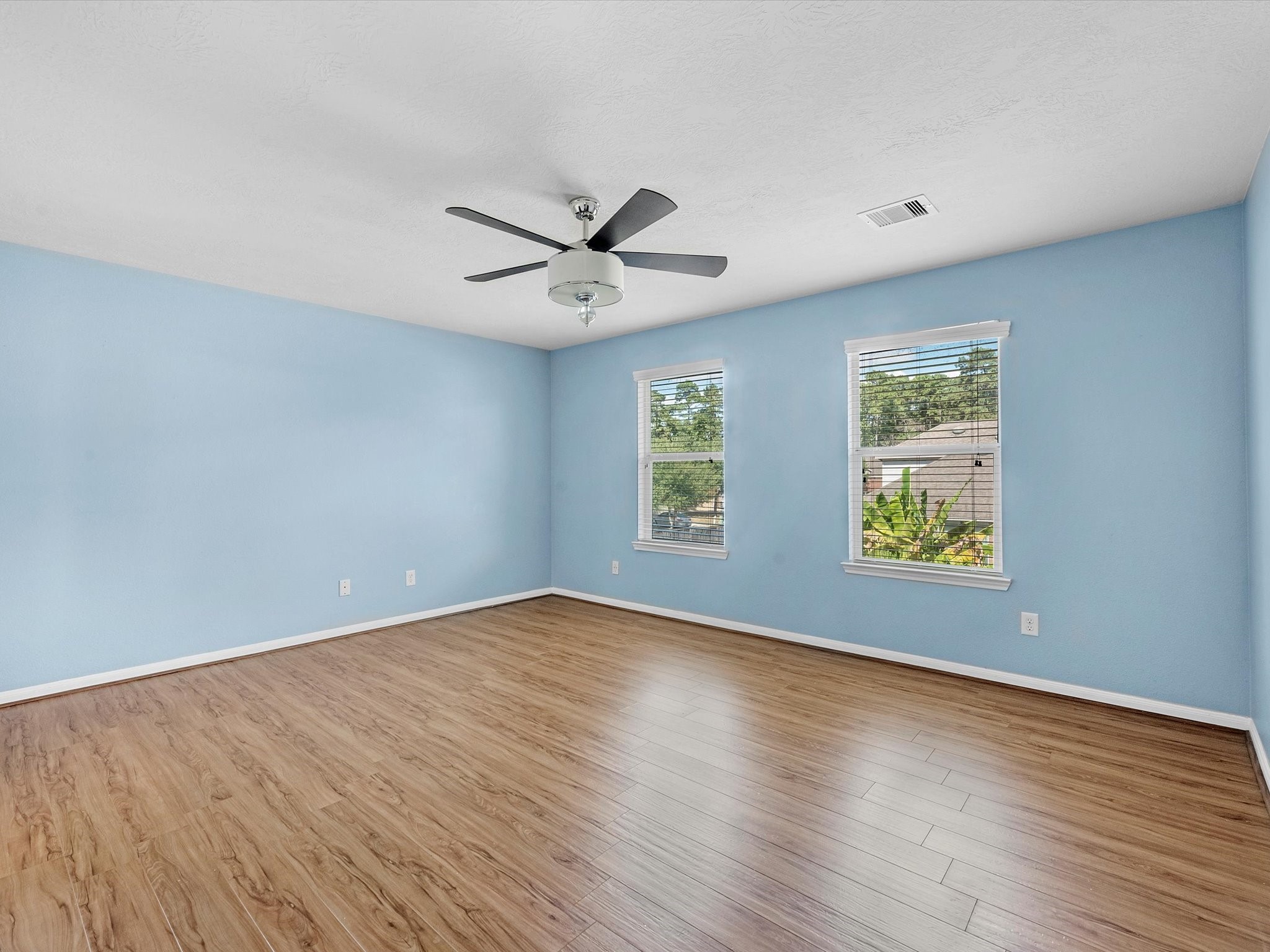 13307 Bomoseen Lake Road Houston, TX 77044 - Photo 24 of 40 an empty room with wooden floor and windows