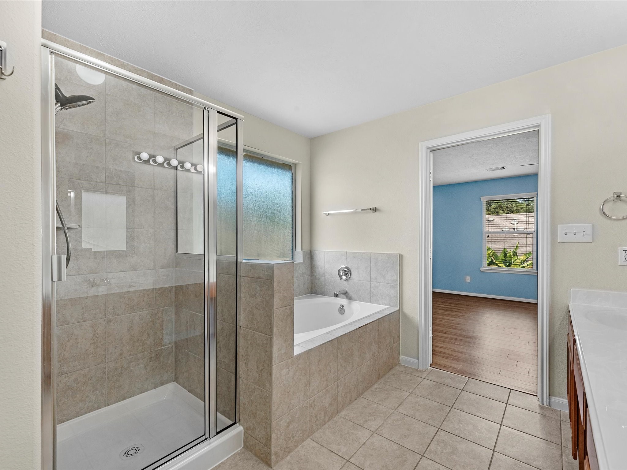 13307 Bomoseen Lake Road Houston, TX 77044 - Photo 27 of 40 a bathroom with a tub shower and sink