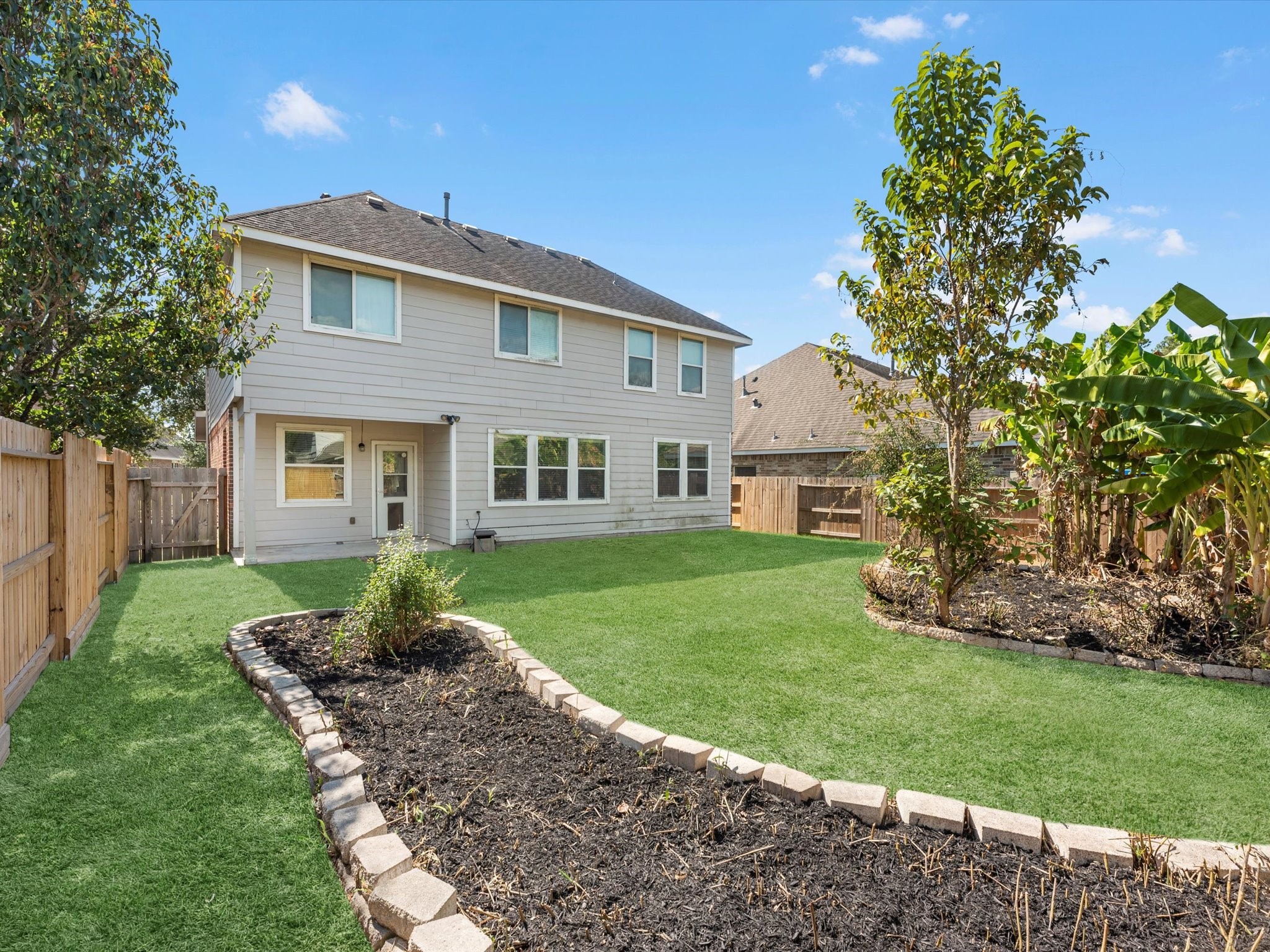 13307 Bomoseen Lake Road Houston, TX 77044 - Photo 34 of 40 a front view of a house with a yard