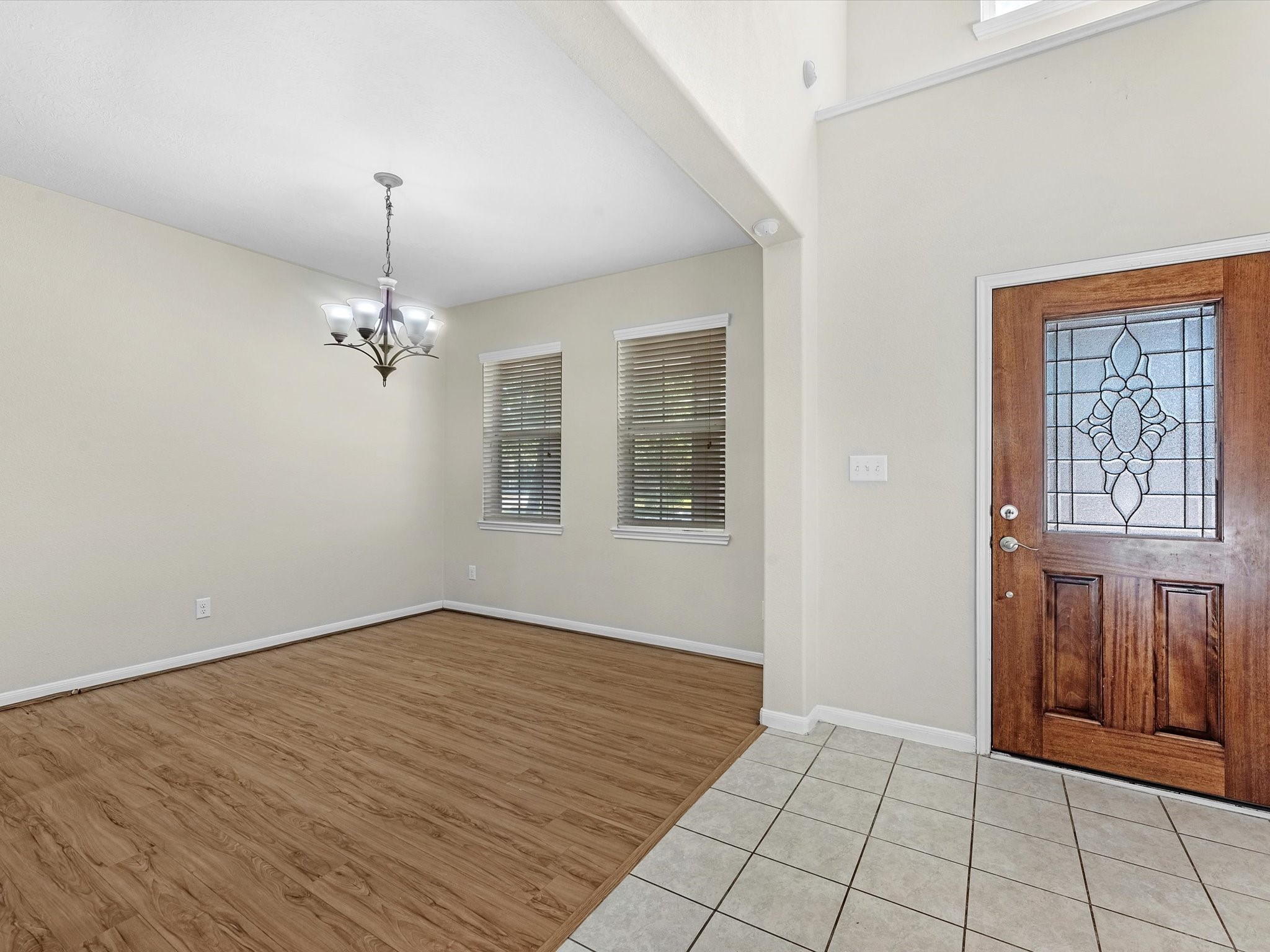 13307 Bomoseen Lake Road Houston, TX 77044 - Photo 8 of 40 a view of an empty room with window and wooden floor