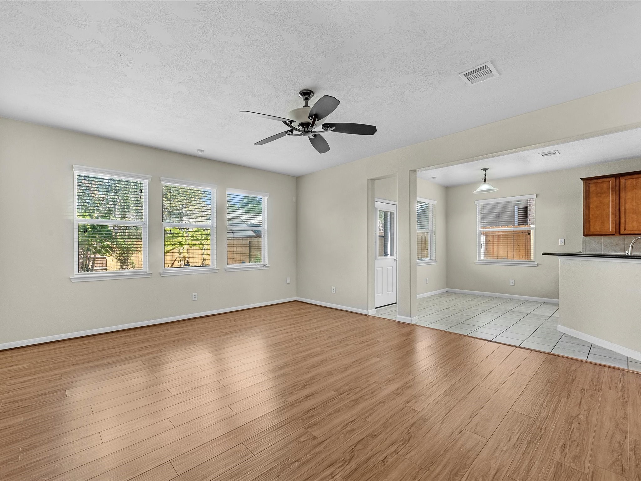 13307 Bomoseen Lake Road Houston, TX 77044 - Photo 10 of 40 a view of an empty room with window and wooden floor