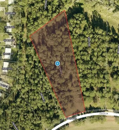 a aerial view of a house with a yard