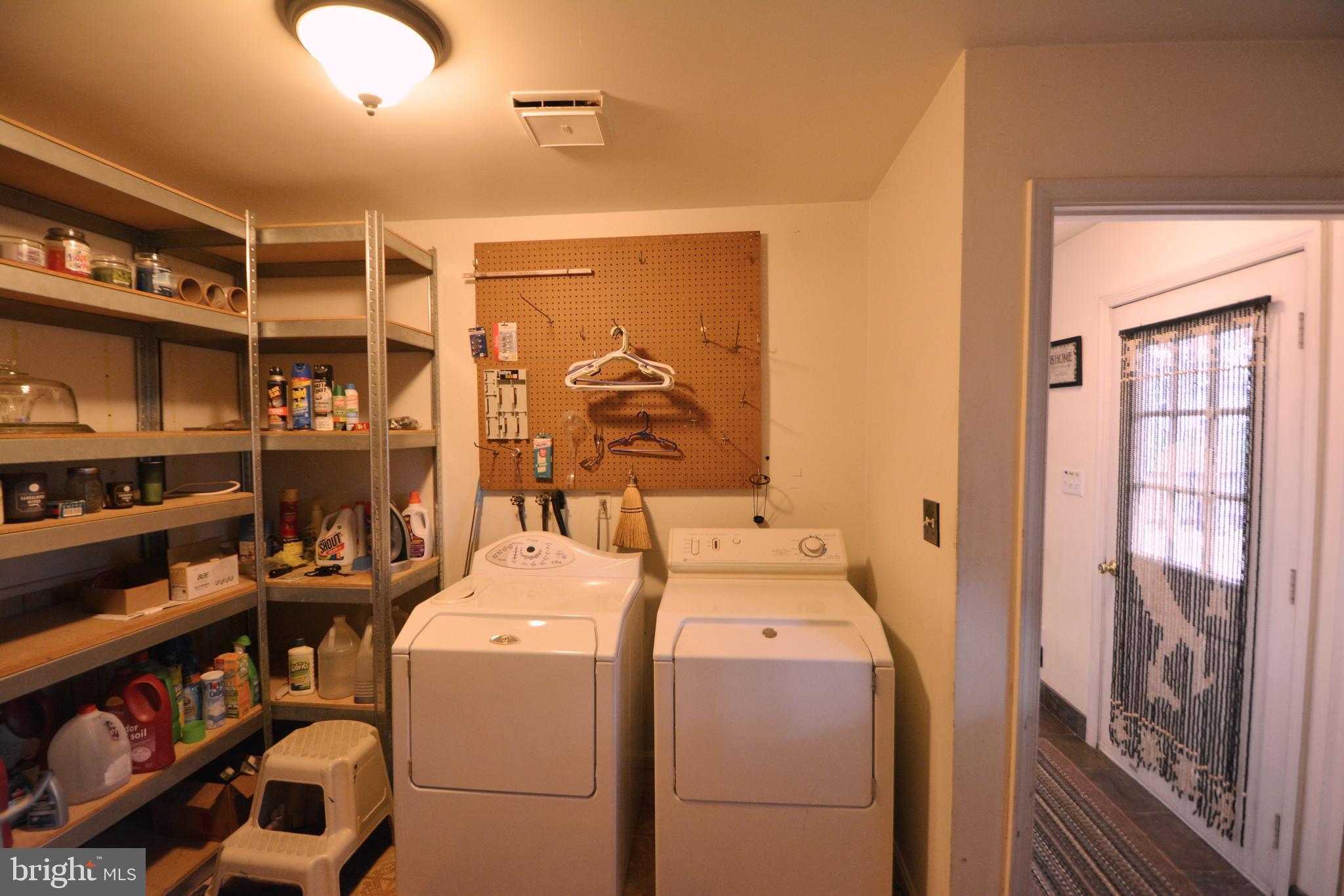 5421 Ridge Road Mount Airy, MD 21771 - Photo 17 of 72 All shelving & peg boards stay & washer dryer.