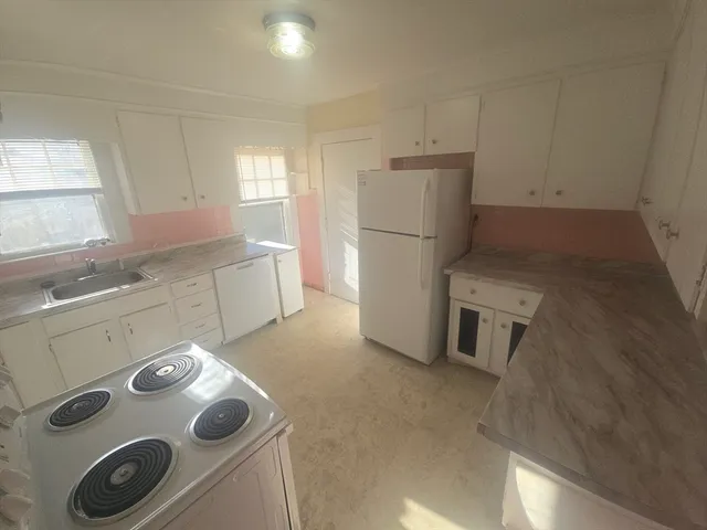 a view of a hallway with staircase