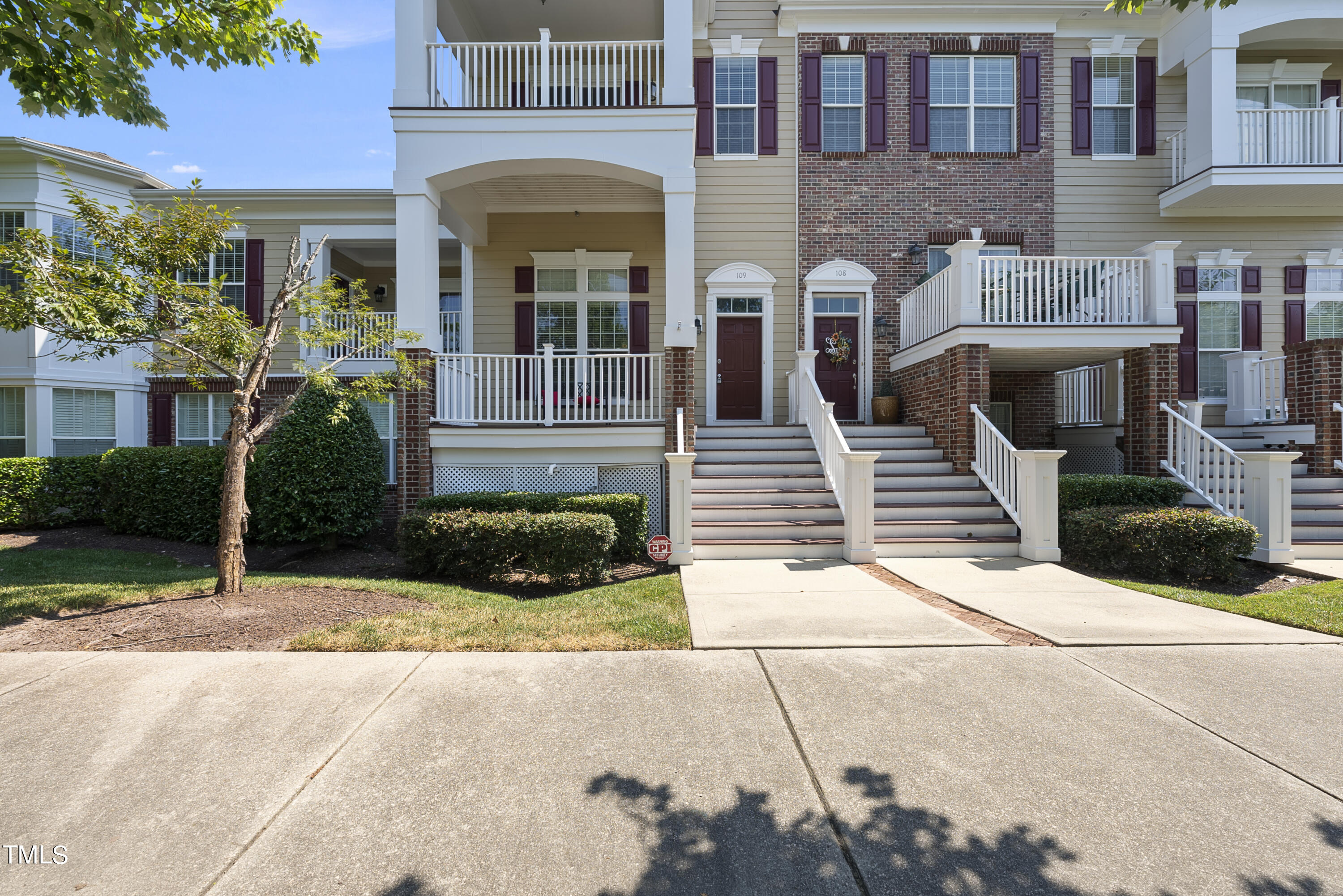 9221 Calabria Drive, Unit 109 Raleigh, NC 27617 - Photo 1 of 34 a front view of a house with garden