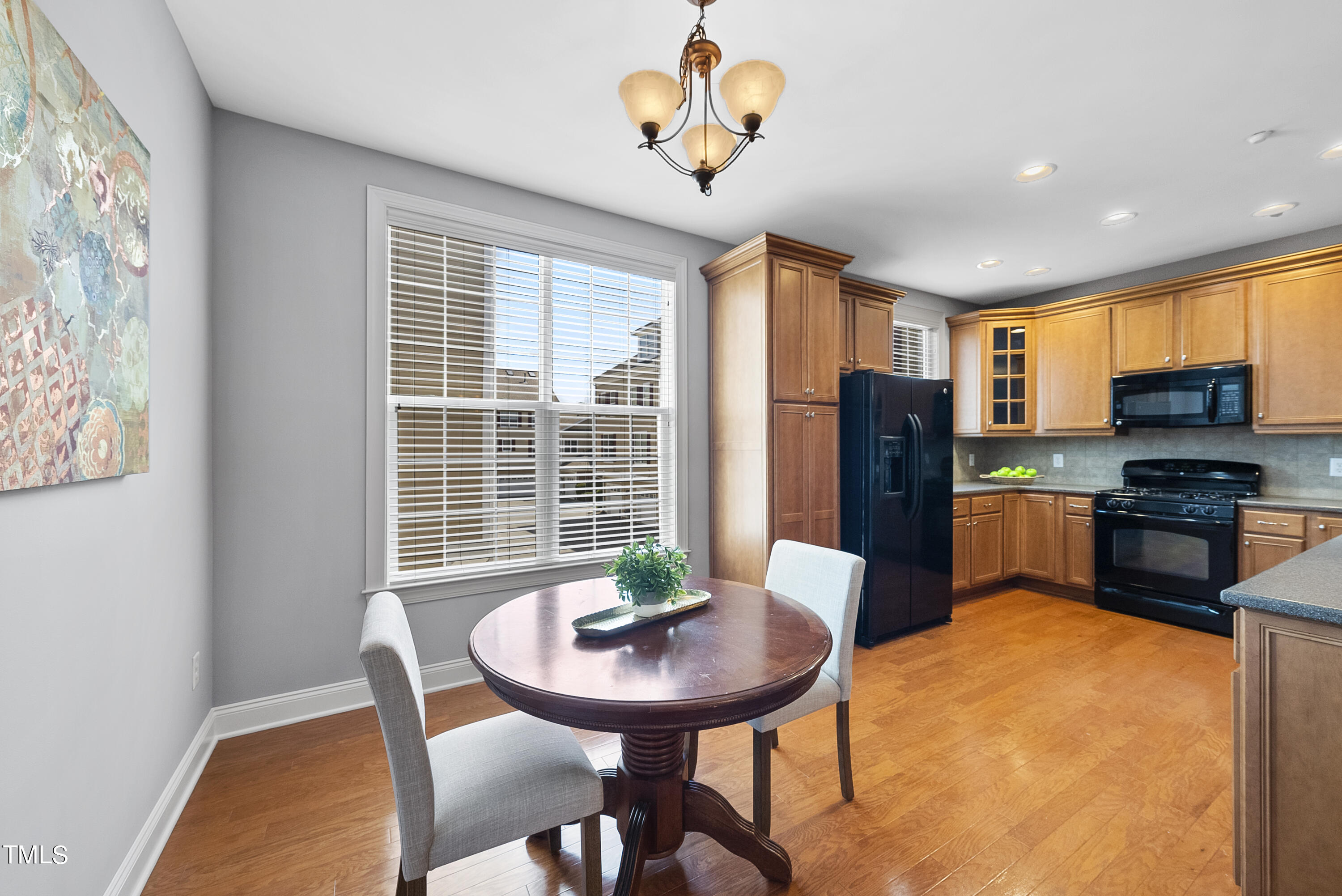 9221 Calabria Drive, Unit 109 Raleigh, NC 27617 - Photo 11 of 34 a view of a dining room with furniture window and outside view