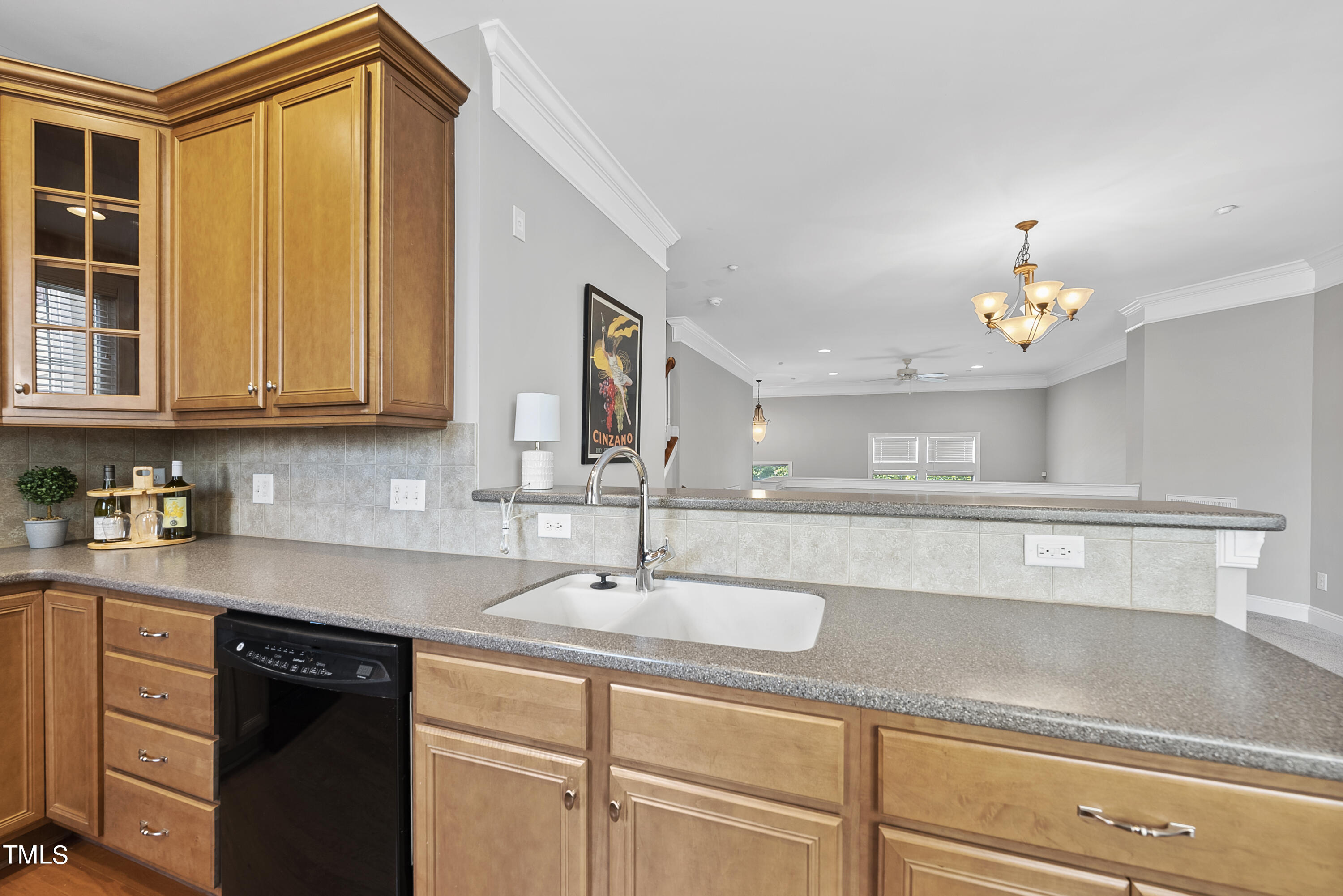 9221 Calabria Drive, Unit 109 Raleigh, NC 27617 - Photo 13 of 34 a kitchen with a sink and cabinets
