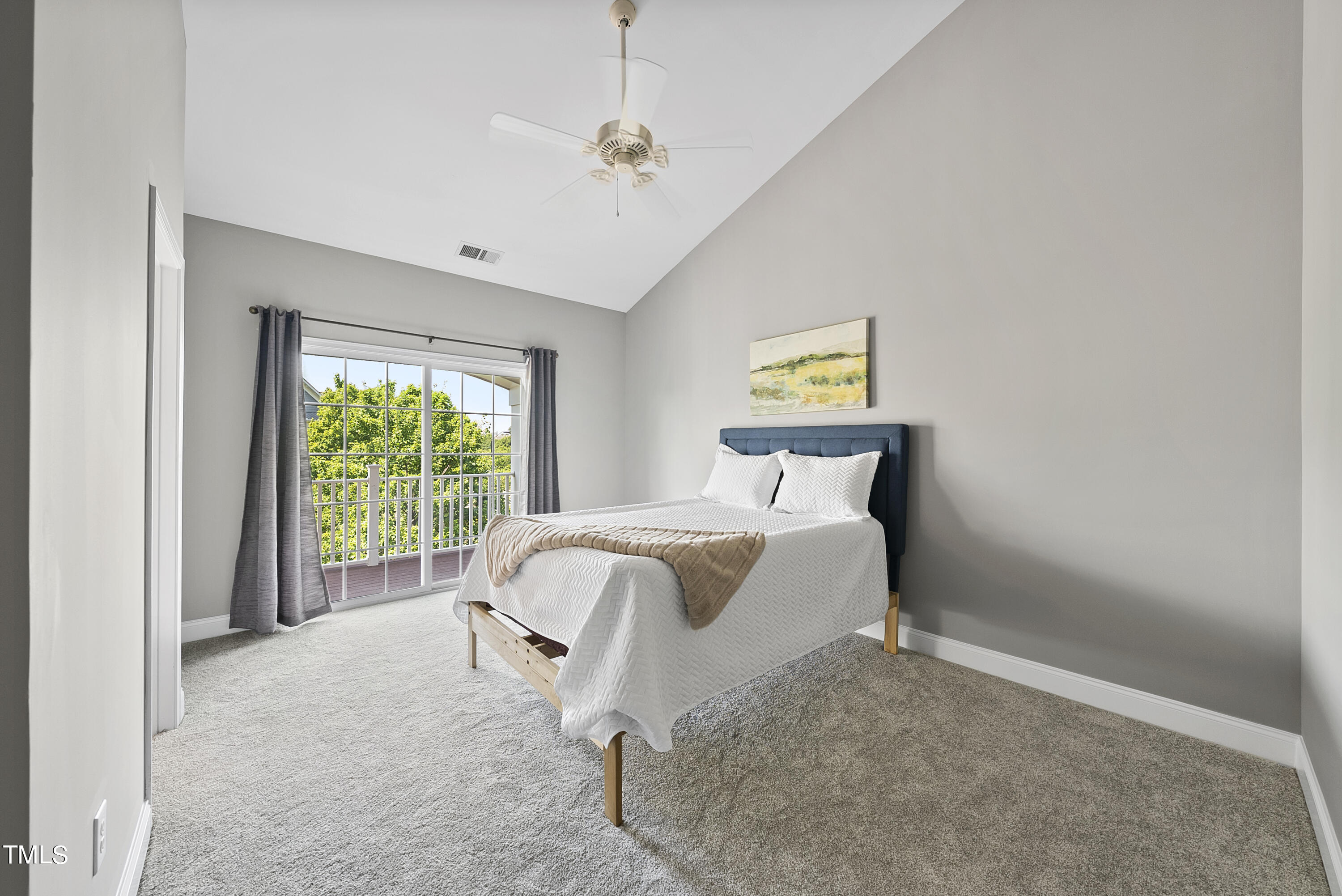 9221 Calabria Drive, Unit 109 Raleigh, NC 27617 - Photo 17 of 34 a bedroom with a bed and a window