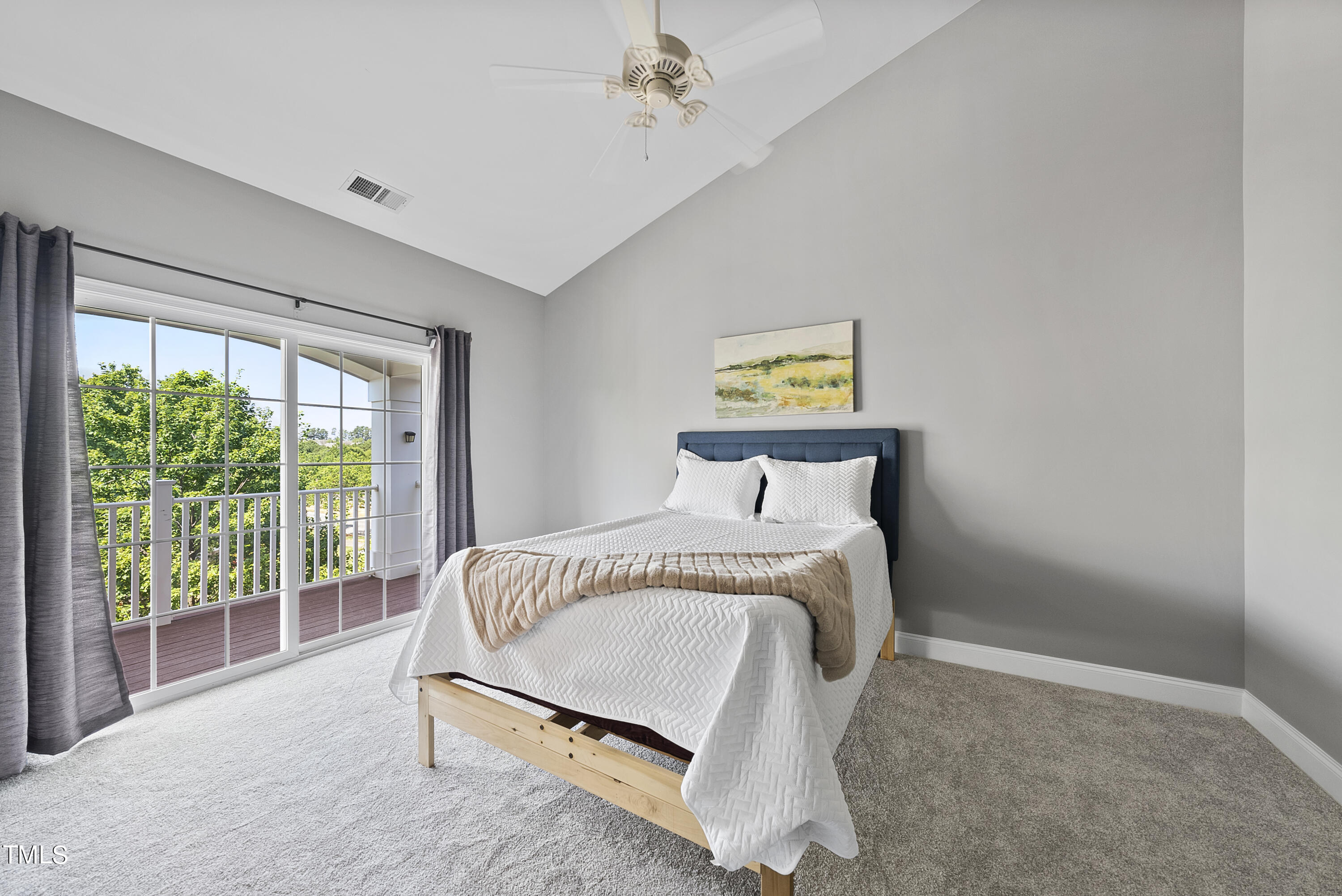 9221 Calabria Drive, Unit 109 Raleigh, NC 27617 - Photo 18 of 34 a bedroom with a bed and a window