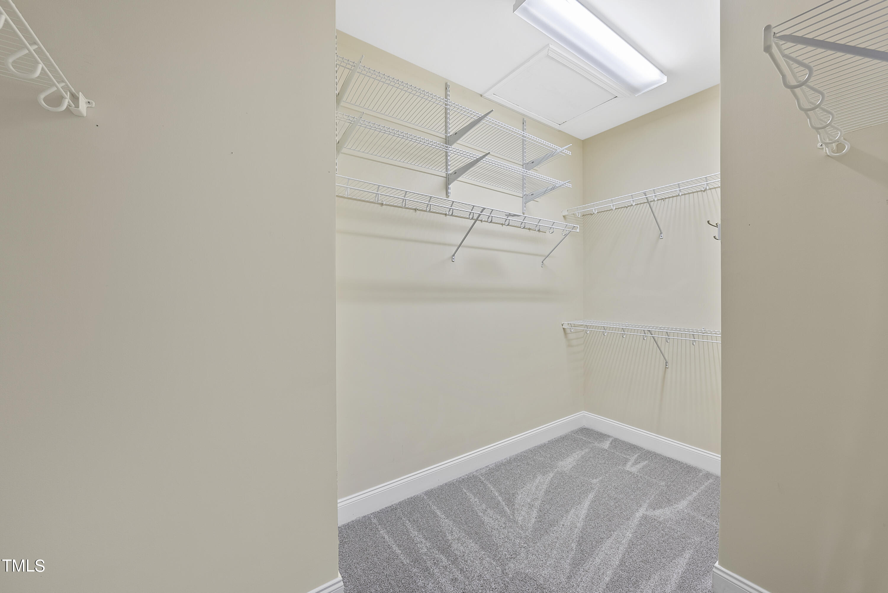 9221 Calabria Drive, Unit 109 Raleigh, NC 27617 - Photo 22 of 34 a view of a room with racks on the wall