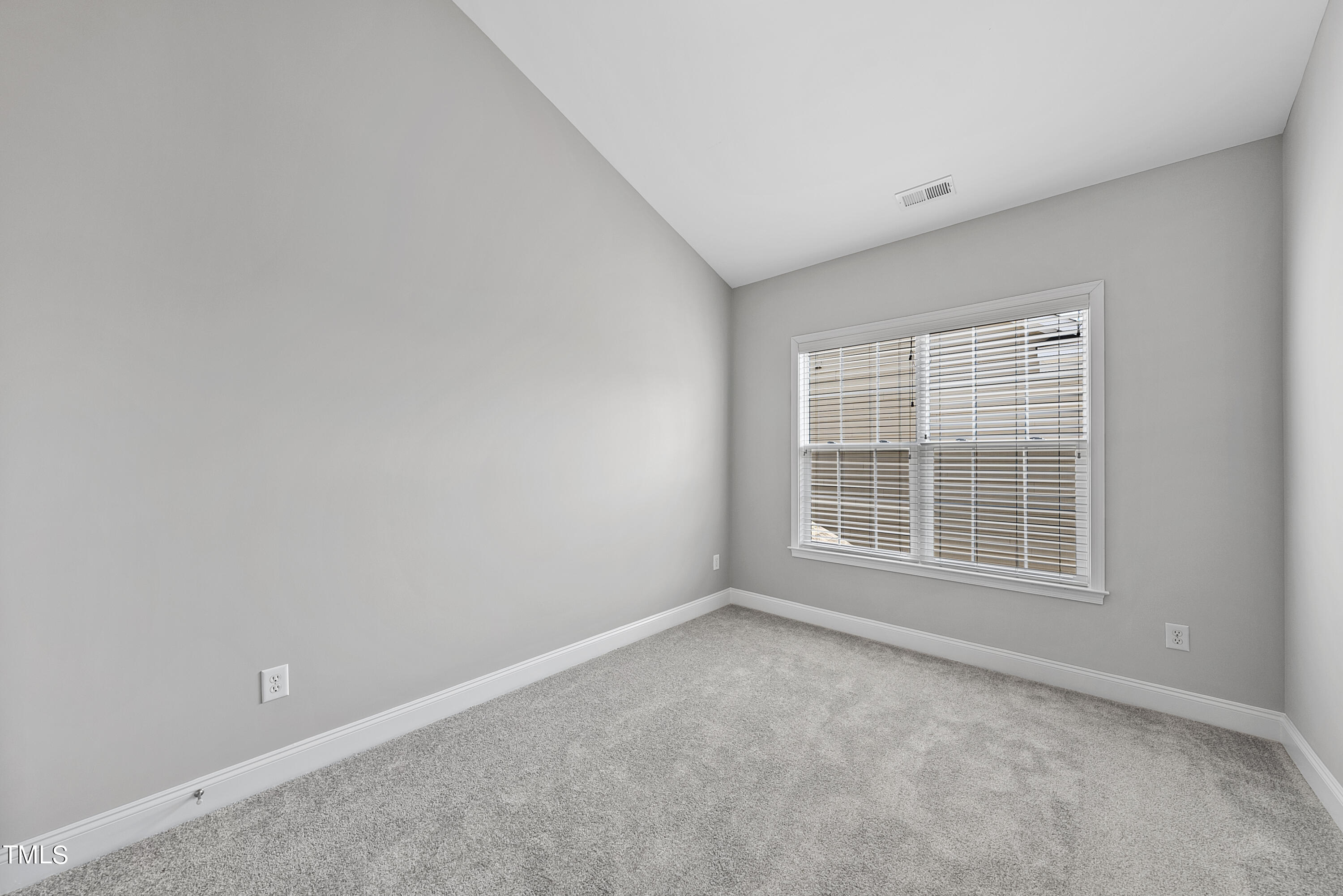 9221 Calabria Drive, Unit 109 Raleigh, NC 27617 - Photo 24 of 34 an empty room with a window