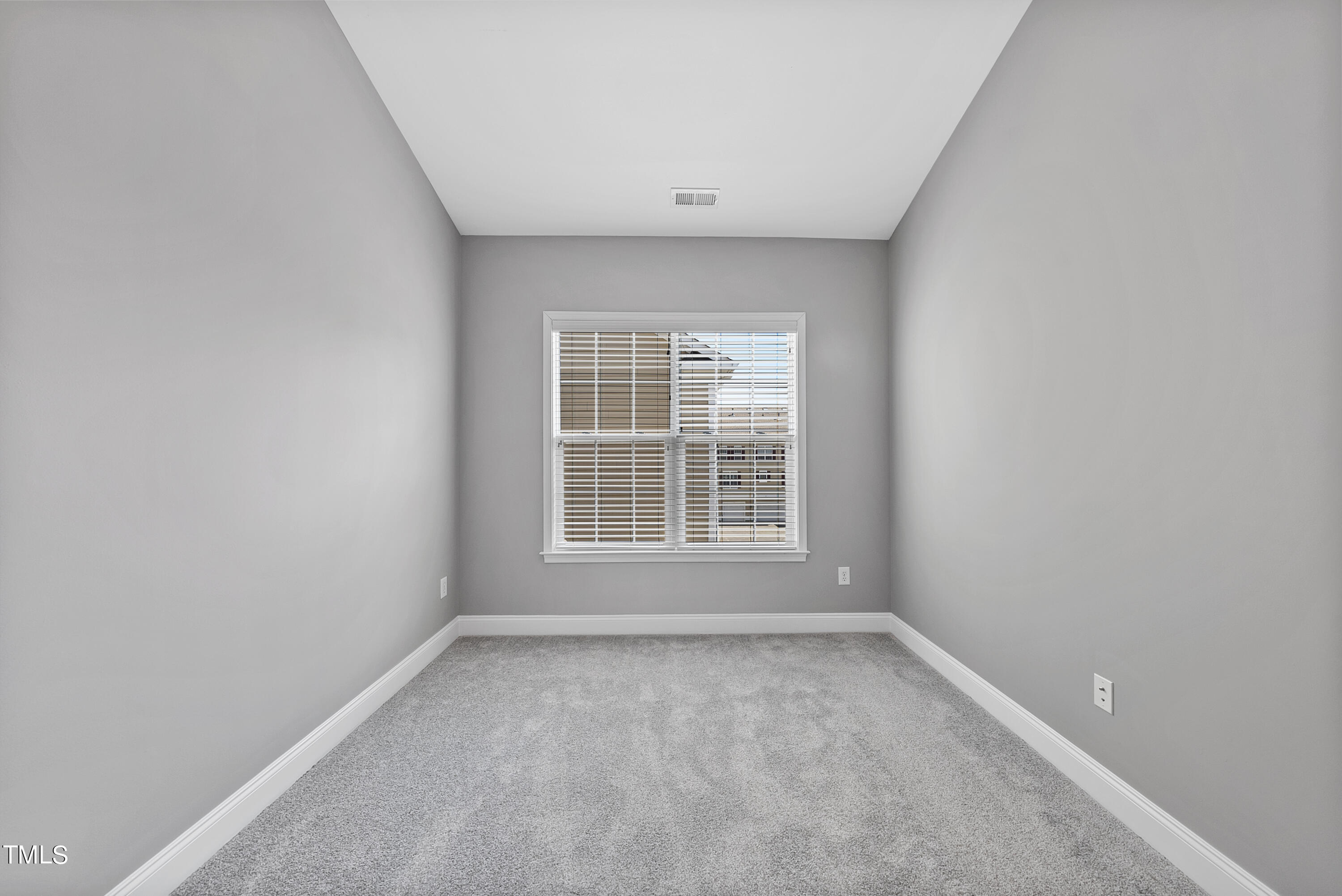 9221 Calabria Drive, Unit 109 Raleigh, NC 27617 - Photo 25 of 34 a view of an empty room with a window