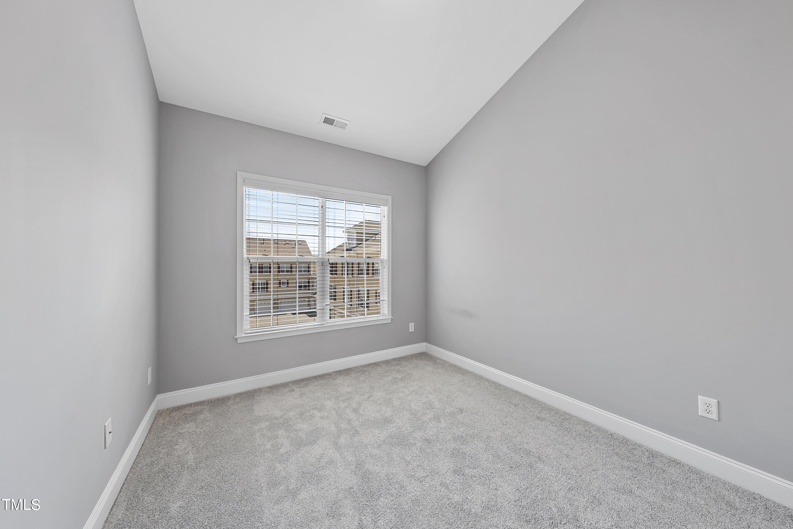 9221 Calabria Drive, Unit 109 Raleigh, NC 27617 - Photo 26 of 34 an empty room with a window