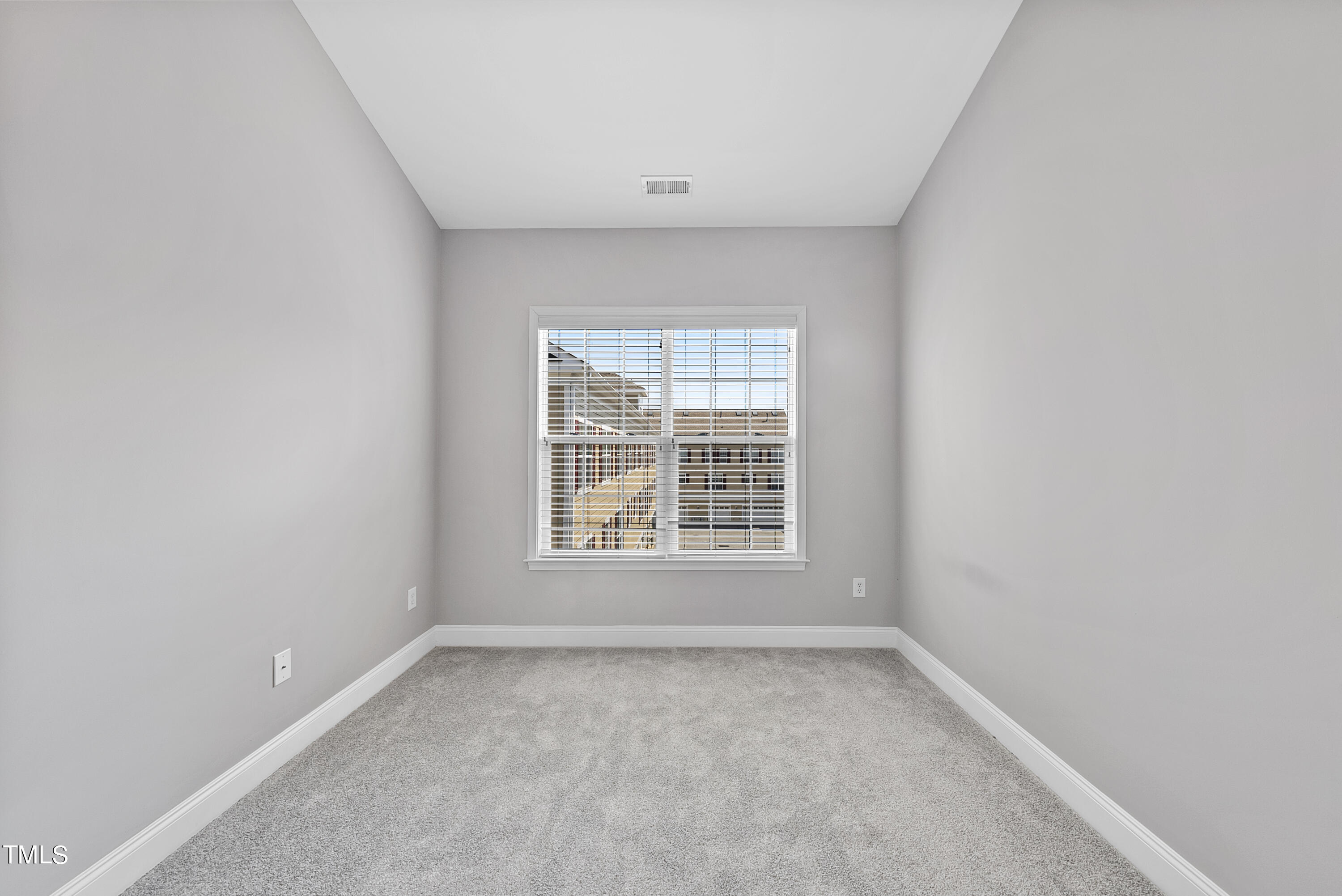 9221 Calabria Drive, Unit 109 Raleigh, NC 27617 - Photo 27 of 34 an empty room with a window