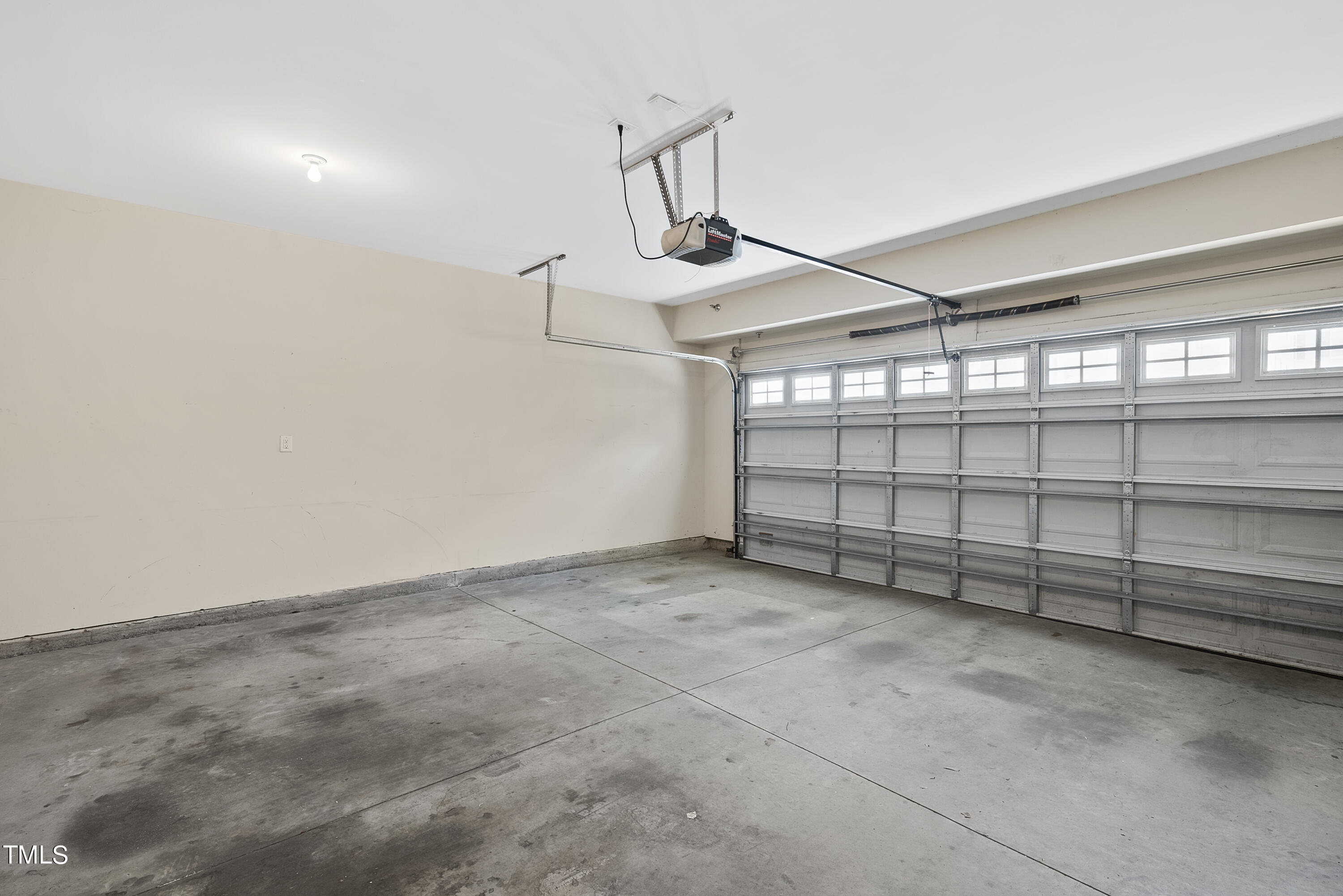 9221 Calabria Drive, Unit 109 Raleigh, NC 27617 - Photo 29 of 34 a view of a garage