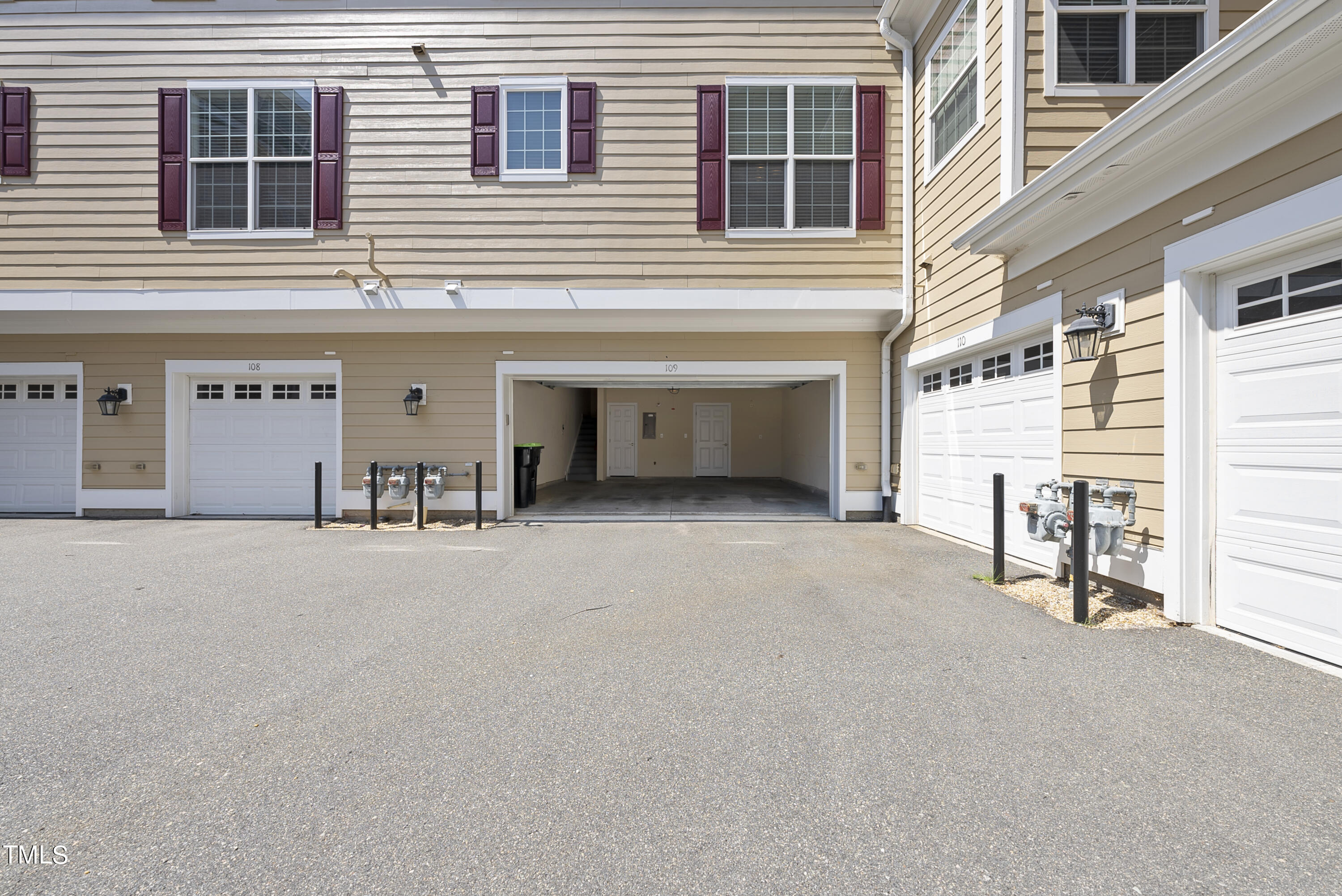 9221 Calabria Drive, Unit 109 Raleigh, NC 27617 - Photo 30 of 34 a view of a house with a patio