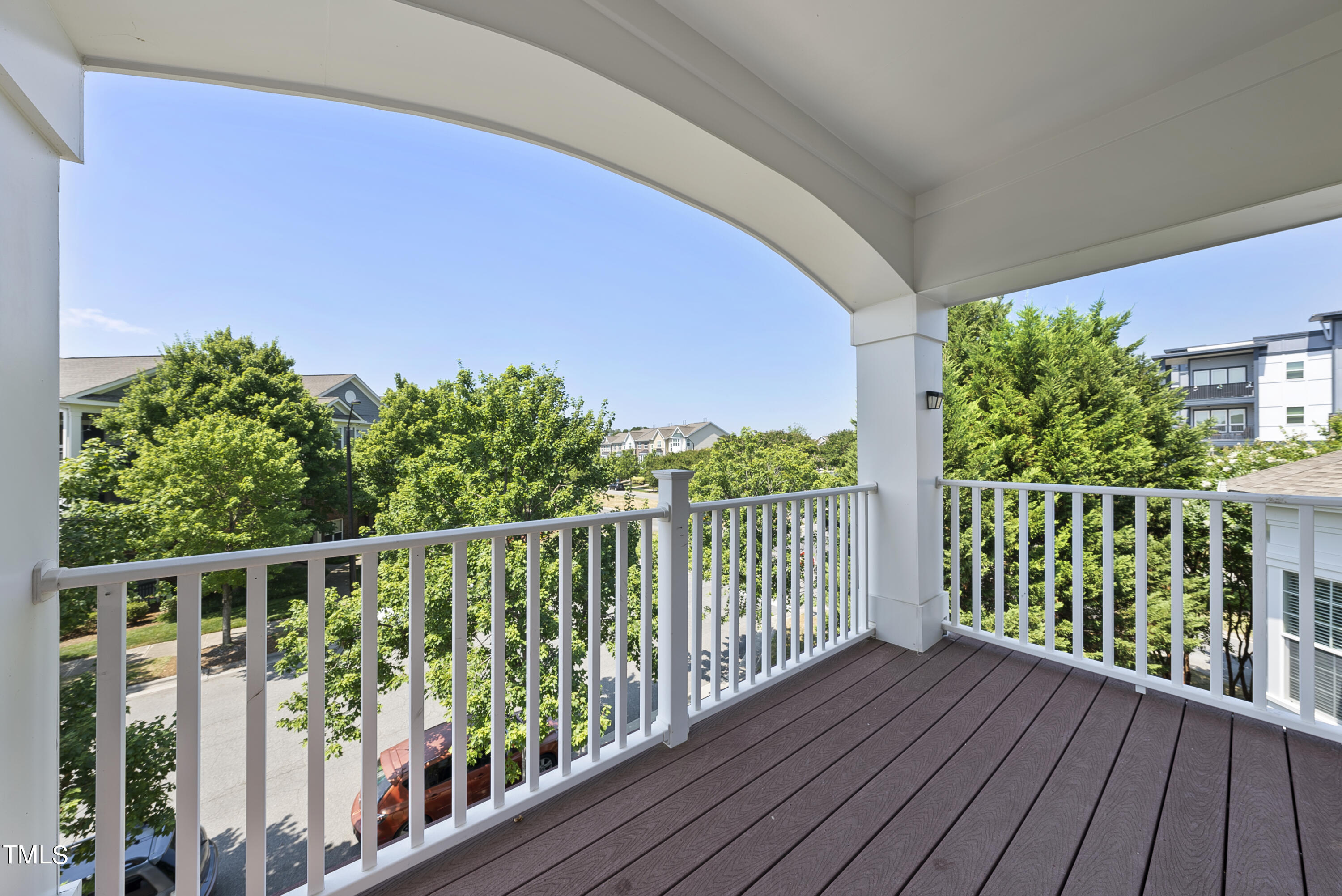 9221 Calabria Drive, Unit 109 Raleigh, NC 27617 - Photo 32 of 34 a view of a balcony with wooden floor