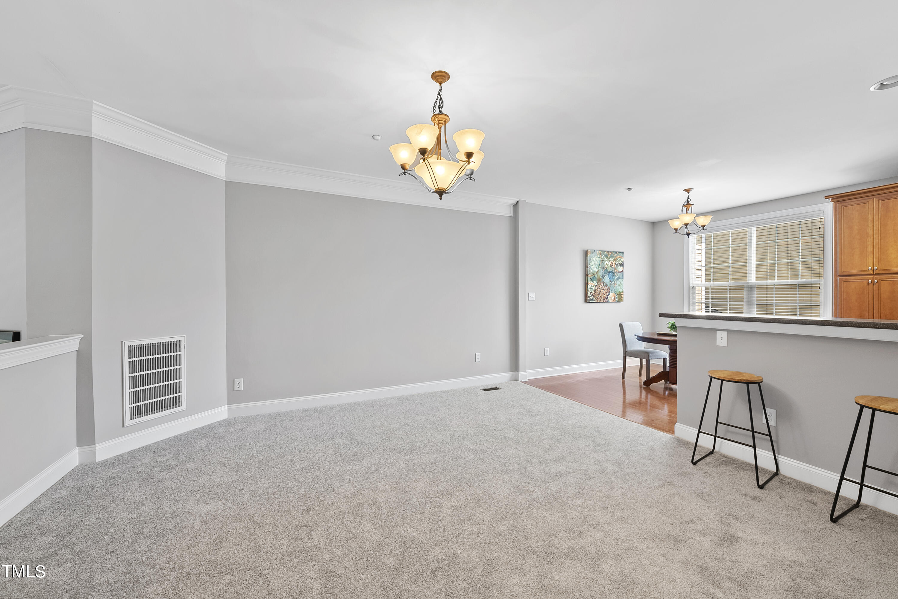 9221 Calabria Drive, Unit 109 Raleigh, NC 27617 - Photo 6 of 34 a view of a livingroom with furniture and windows