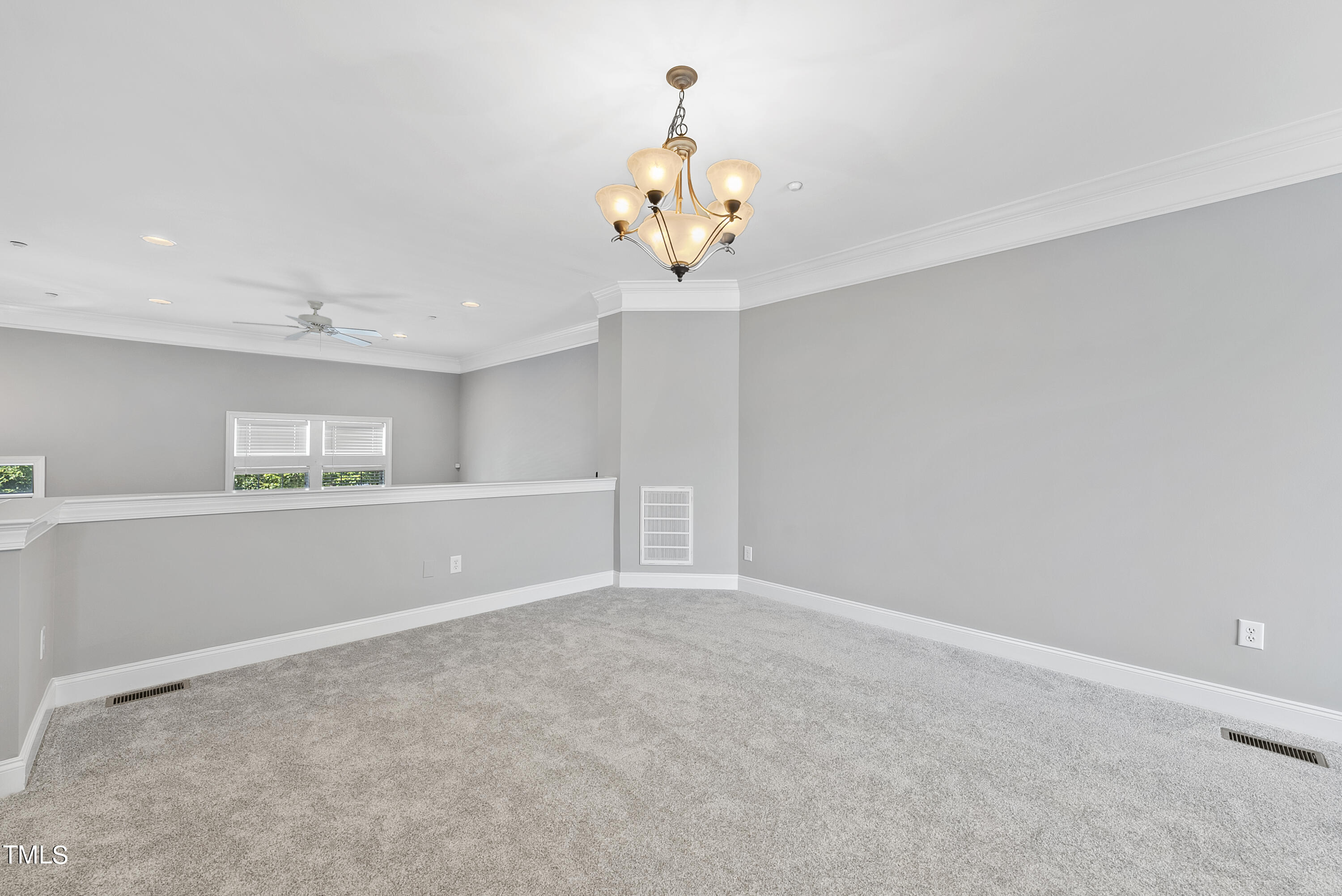 9221 Calabria Drive, Unit 109 Raleigh, NC 27617 - Photo 7 of 34 a view of an empty room with a window