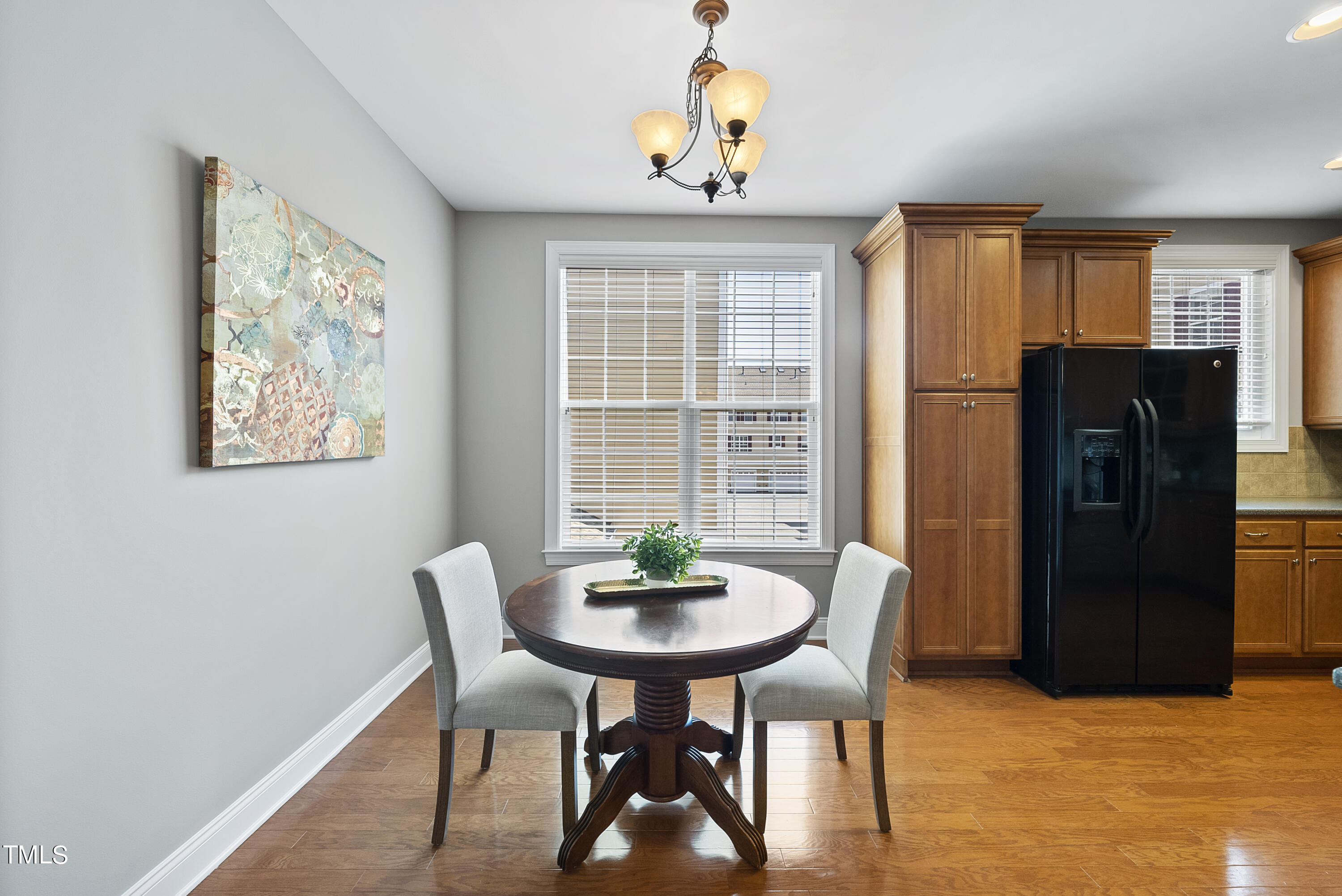 9221 Calabria Drive, Unit 109 Raleigh, NC 27617 - Photo 10 of 34 a dining room with furniture and window
