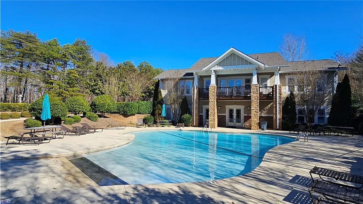 303 Lookover Drive Anderson, SC 29621 - Photo 39 of 46 This community pool offers refreshing leisure with a well-maintained swimming area and ample relaxation space.