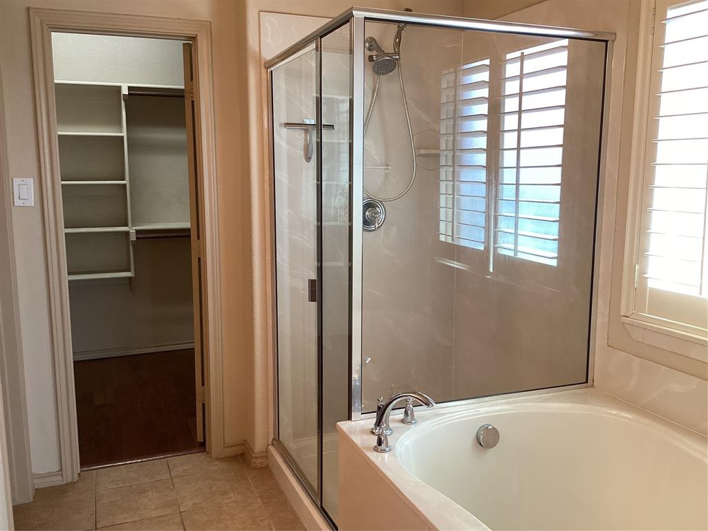 10213 Point Lobos Trail Fort Worth, TX 76177 - Photo 13 of 29 a bathroom with a tub and shower