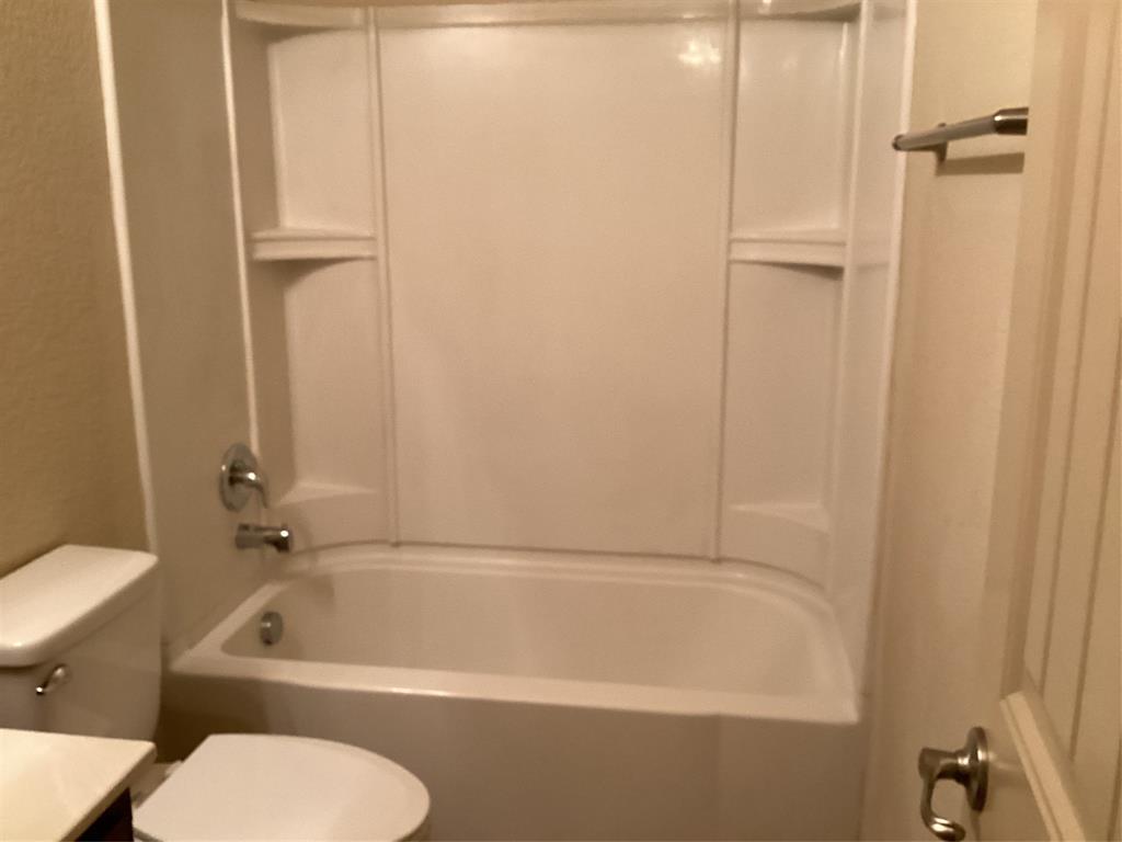 10213 Point Lobos Trail Fort Worth, TX 76177 - Photo 20 of 29 a bathroom with a tub a sink and toilet