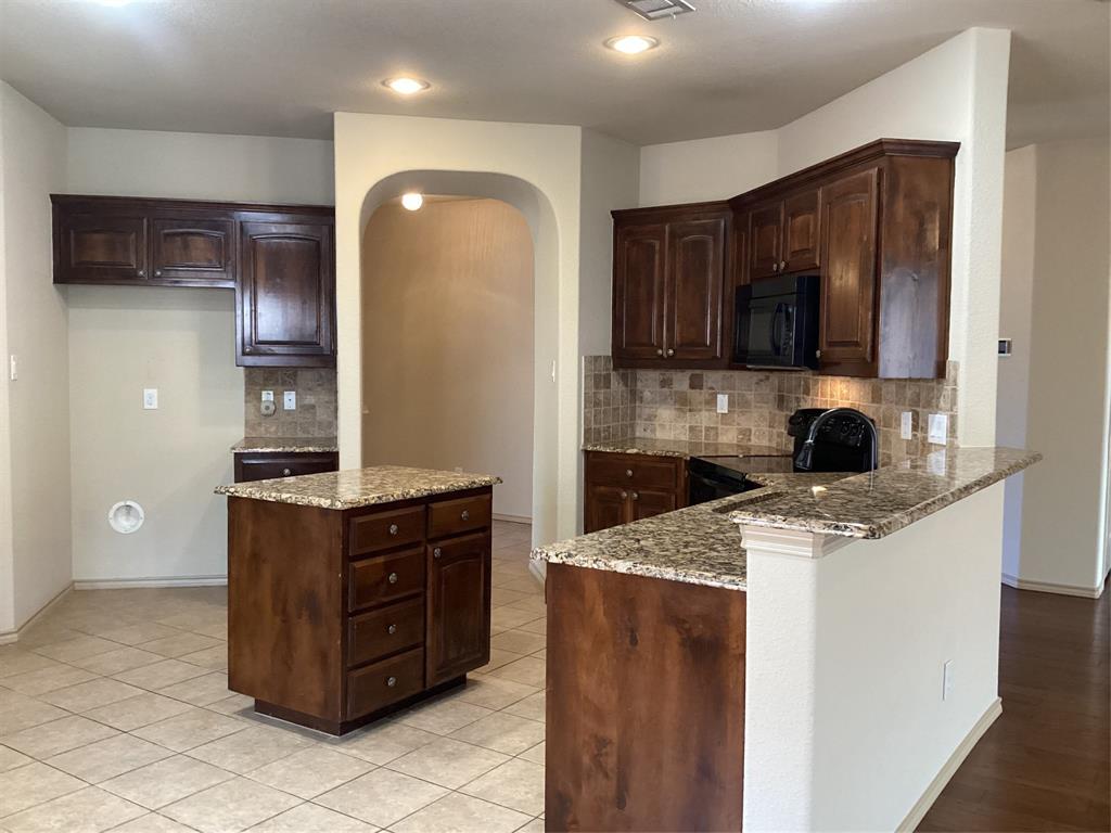 10213 Point Lobos Trail Fort Worth, TX 76177 - Photo 5 of 29 a kitchen with a stove and a sink