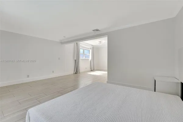 an empty room with a bathroom and a toilet