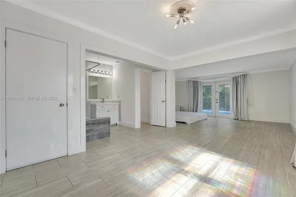 a view of an empty room with a window