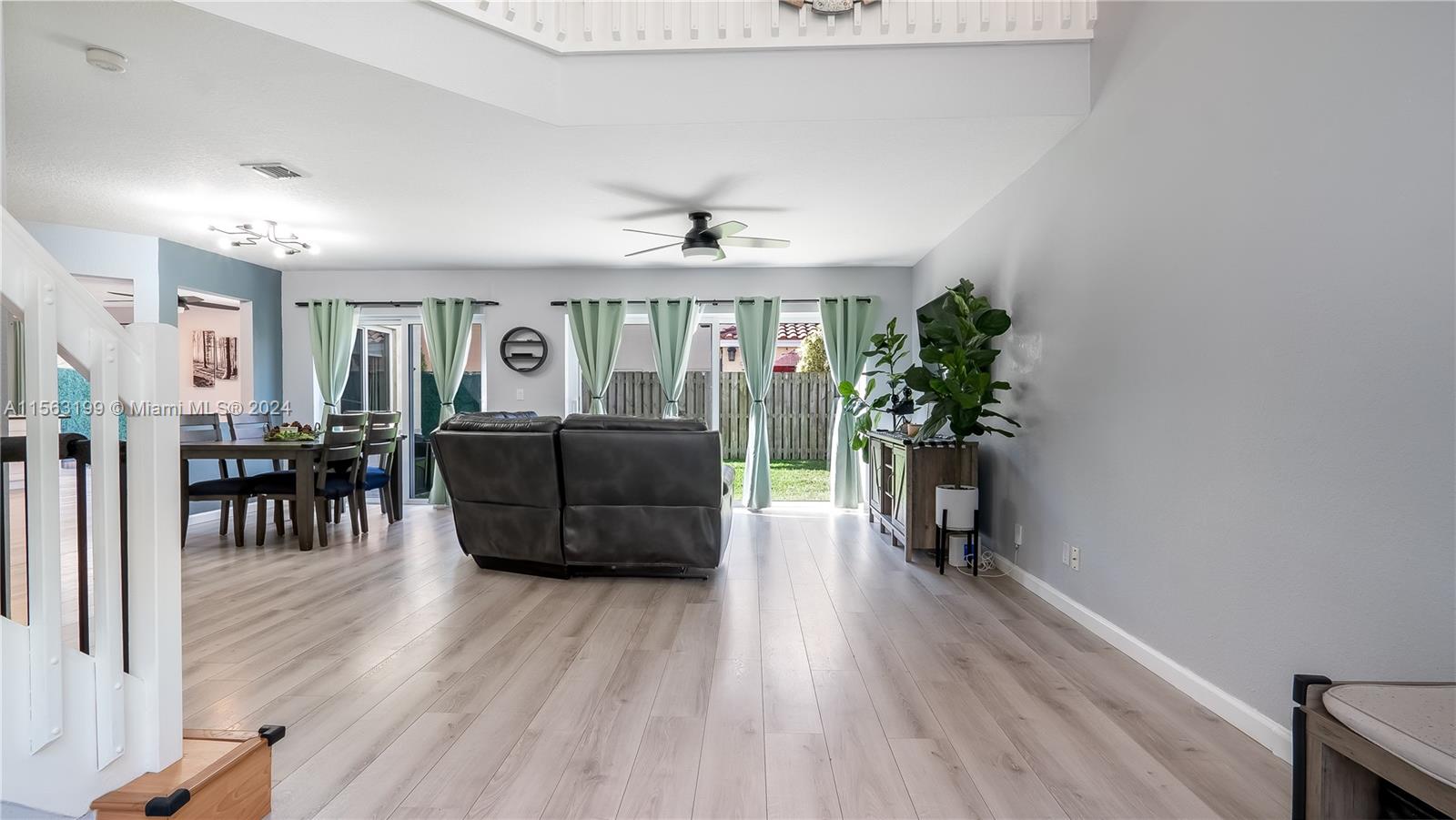 11272 Roundelay Road Cooper City, FL 33026 - Photo 3 of 47 a living room with furniture and a wooden floor