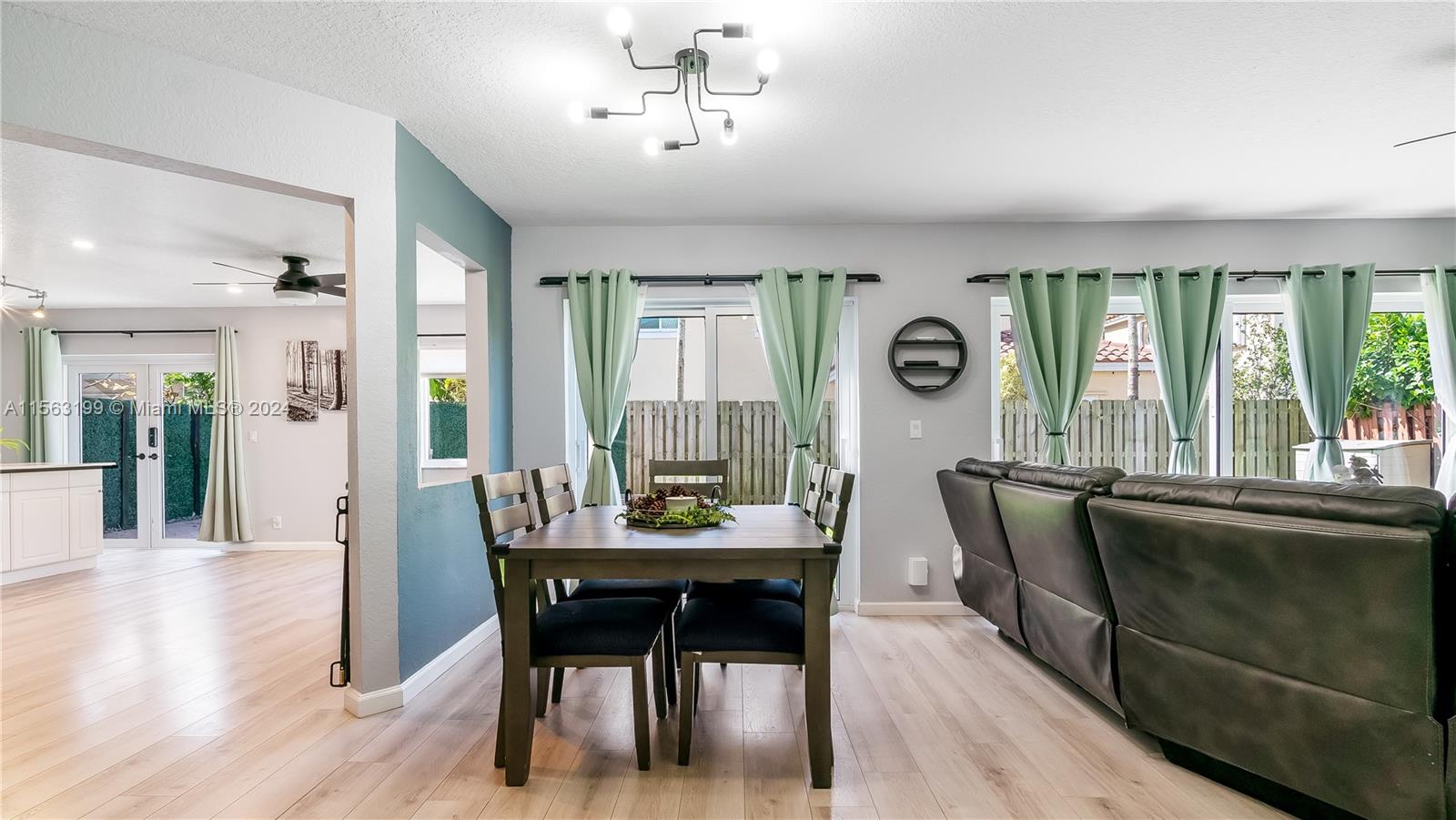 11272 Roundelay Road Cooper City, FL 33026 - Photo 8 of 47 a view of a dining room with furniture window and wooden floor