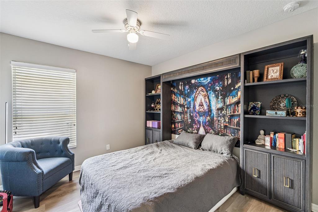 2523 Martins Run Tavares, FL 32778 - Photo 12 of 21 a bedroom with a large bed and a window