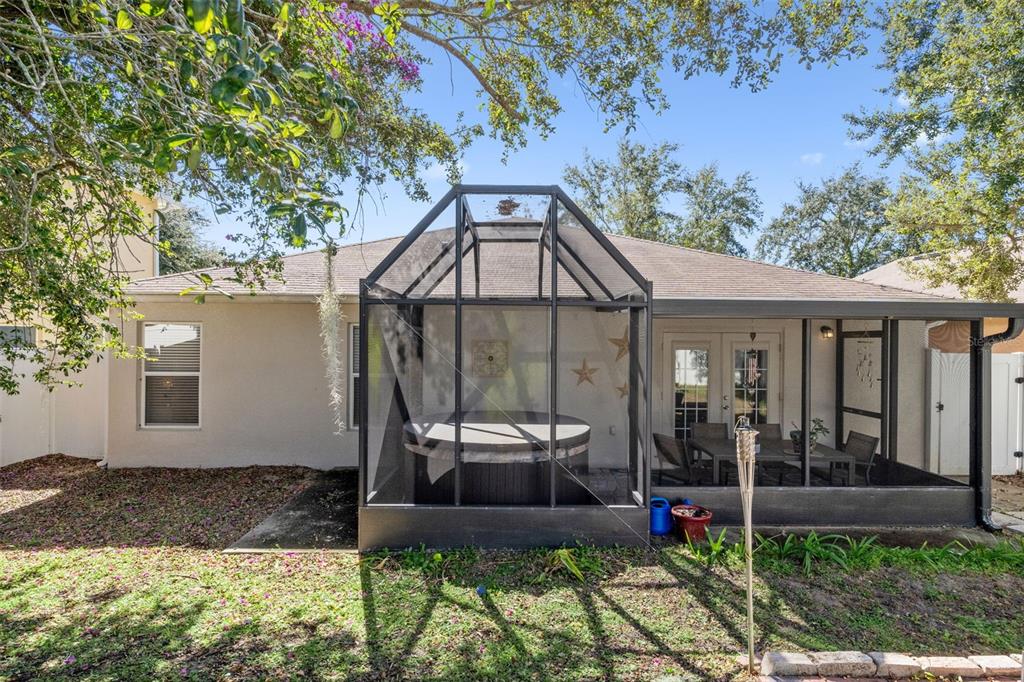 2523 Martins Run Tavares, FL 32778 - Photo 17 of 21 a view of a chair and table in backyard of the house