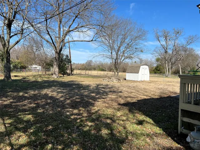 a view of open space with yard