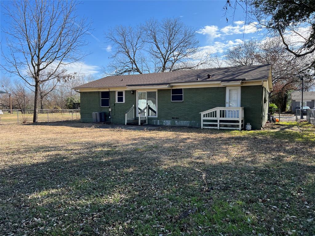 303 Cumberland Road Waxahachie, TX 75165 - Photo 3 of 4 a view of a house with a yard and large tree