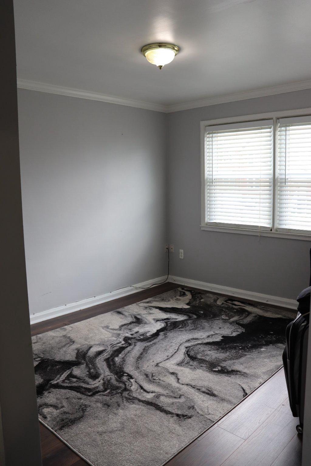 1328 Cedarcroft Road Baltimore, MD 21239 - Photo 19 of 39 Bright bedroom with hardwood floors and window.
